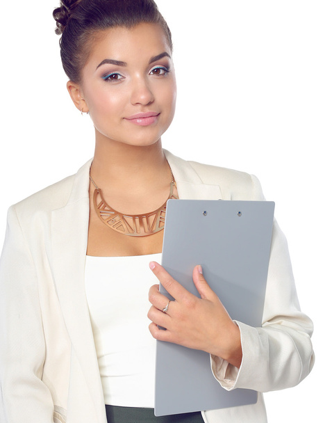 Portrait of business woman standing with folder - Foto, afbeelding