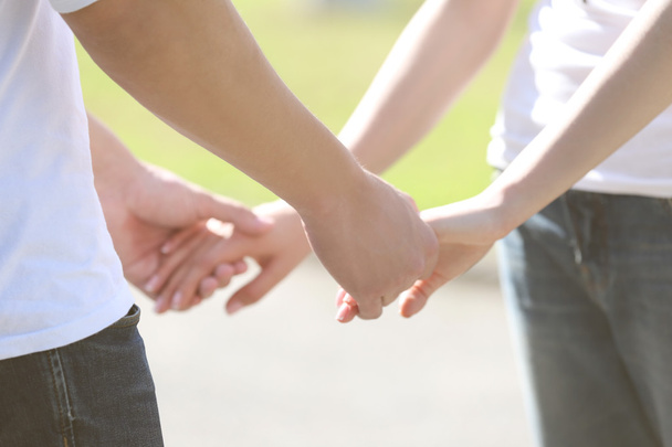 Couple holding hands - Photo, image