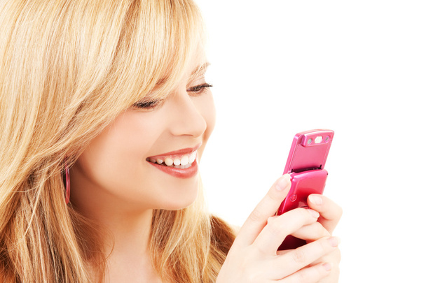 Happy teenage girl with cell phone - Zdjęcie, obraz