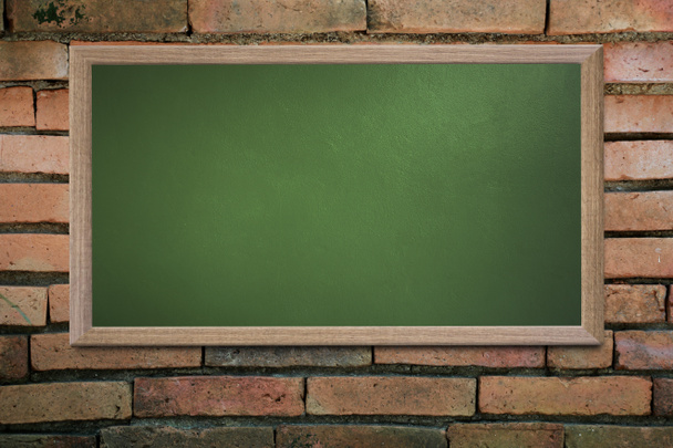 Blank old school blackboard on a grunge wall and can input text  - Photo, Image