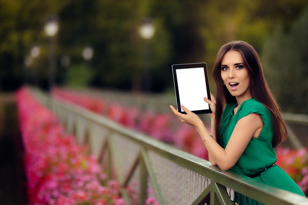 Surprised Woman Showing a Digital Tablet Display - Fotografie, Obrázek