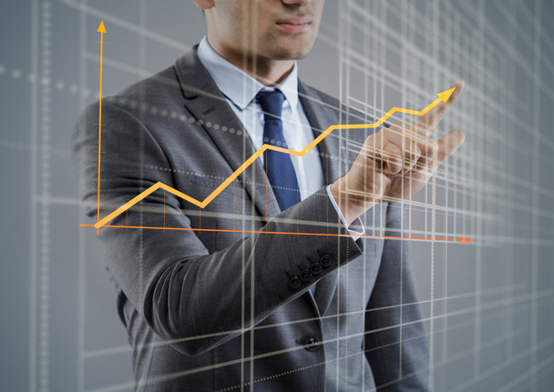 Young businessman with chart diagrams - Photo, Image