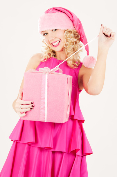 Cheerful santa helper girl with gift box - Foto, immagini