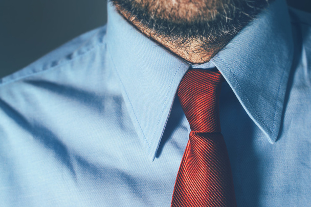 Bearded businessman in blue shirt and red necktie - Foto, Imagen