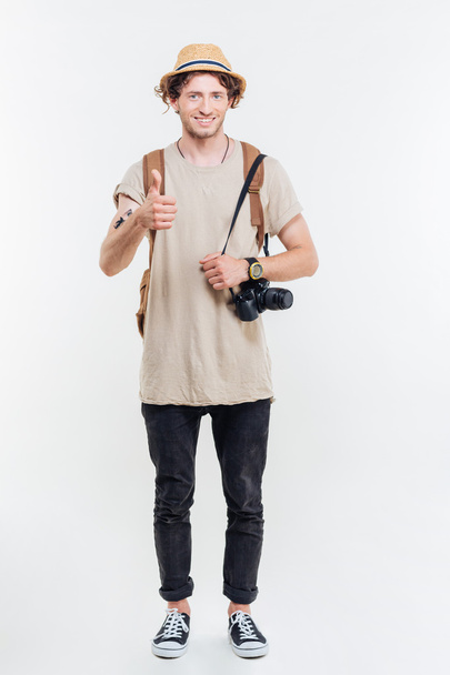 Full length portrait of handsome male tourist looking at camera - Photo, Image