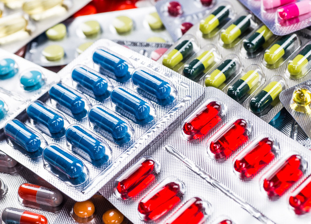 packings of pills and capsules of medicines - 写真・画像