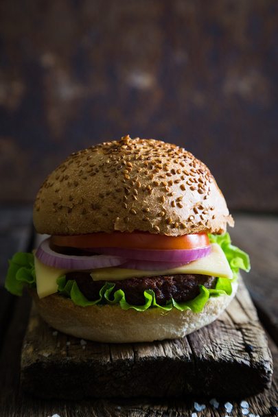 Hamburger on wooden table - Φωτογραφία, εικόνα