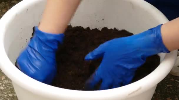 Worker Preparing Mixture For Garden Planting - Video