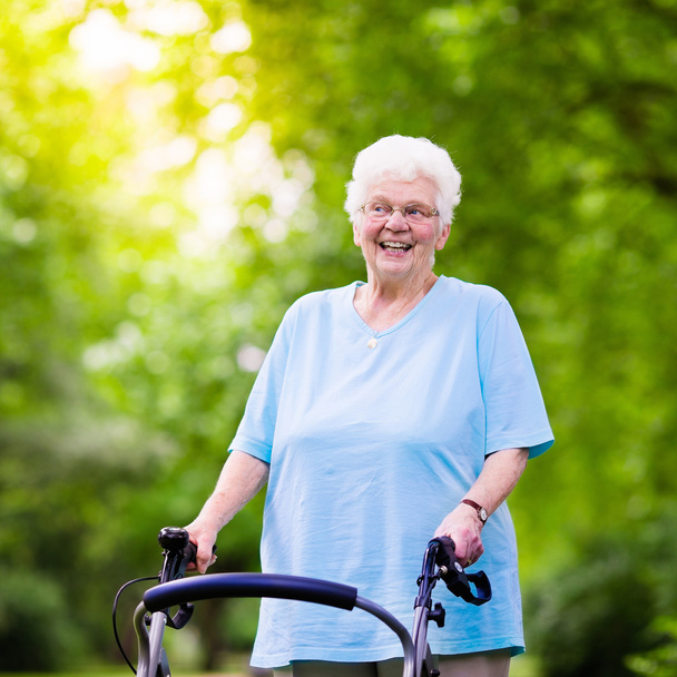 Senior lady with a walker - Φωτογραφία, εικόνα