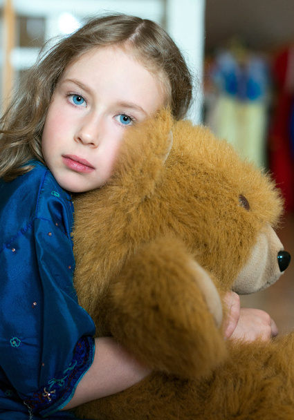 Cute little girl with toy bear. - Фото, изображение