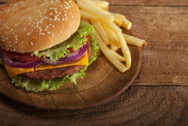 Fresh burger on wooden background - Valokuva, kuva