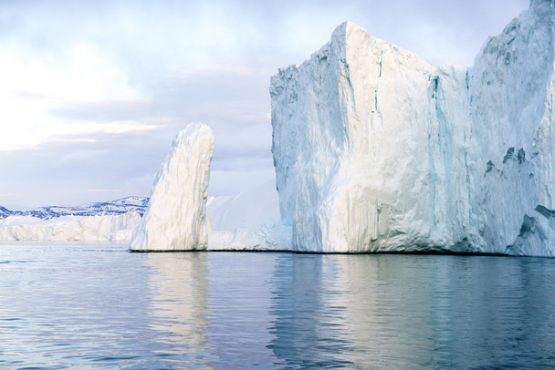 Huge and beautiful glaciers are on the arctic ocean to Ilulissat fjord, Greenland - Photo, Image