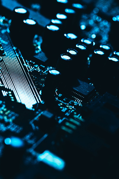 computer motherboard in blue dark background close-up - Fotó, kép