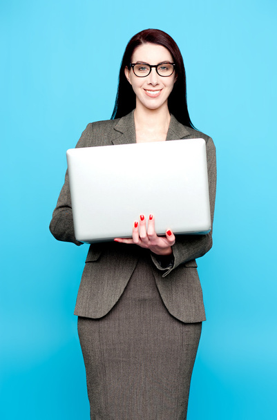 Young active businesswoman working on laptop - Zdjęcie, obraz
