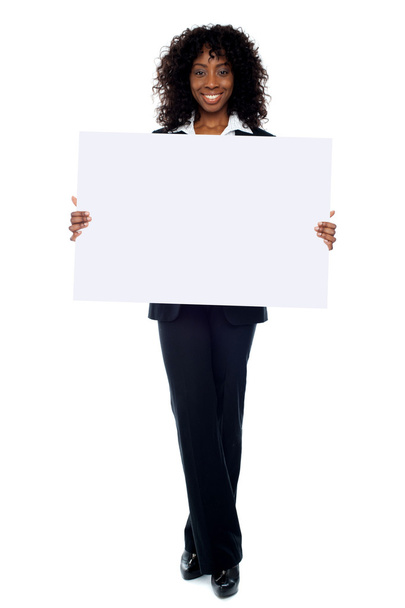 Corporate woman displaying white ad board - Foto, Imagen