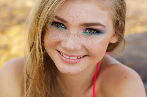 Beautiful girl with freckles over her face - Фото, зображення