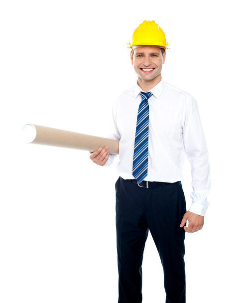 Successful male builder holding blueprints - Foto, afbeelding