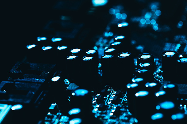 computer motherboard in blue dark background close-up - Foto, afbeelding