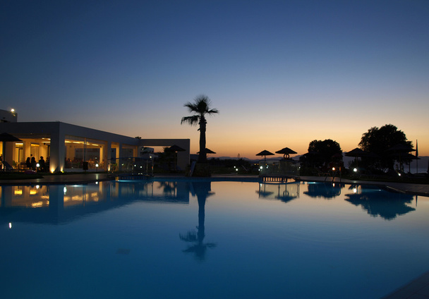 Swimming pool of luxury hotel at dusk - Photo, Image