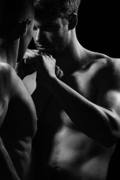 Young muscular men boxing - 写真・画像