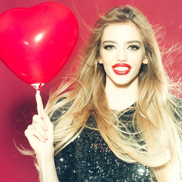 Emotional girl with heart balloon - 写真・画像