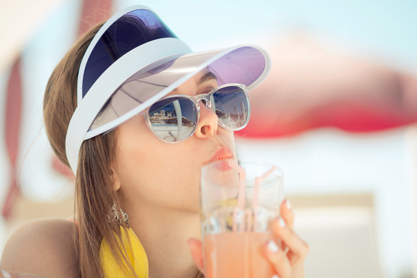 fashionable woman in red swimsuit , cap and stylish sunglasses - Foto, Imagen