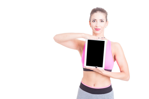 Female holding tablet wearing pink bustier and thighs - Foto, immagini