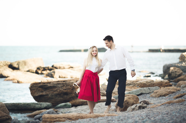 Charming bride, elegant groom on landscapes of mountains and sea Gorgeous wedding couple - Zdjęcie, obraz