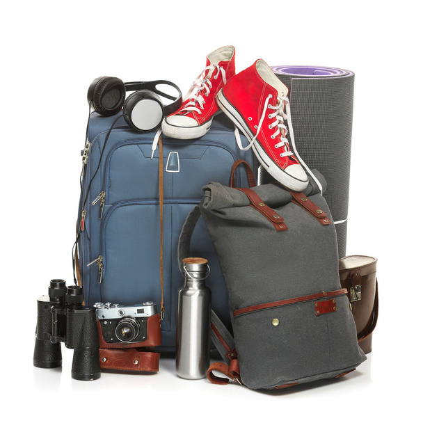 The suitcases, sneakers, retro camera, karrimat and binoculars on white background. - 写真・画像