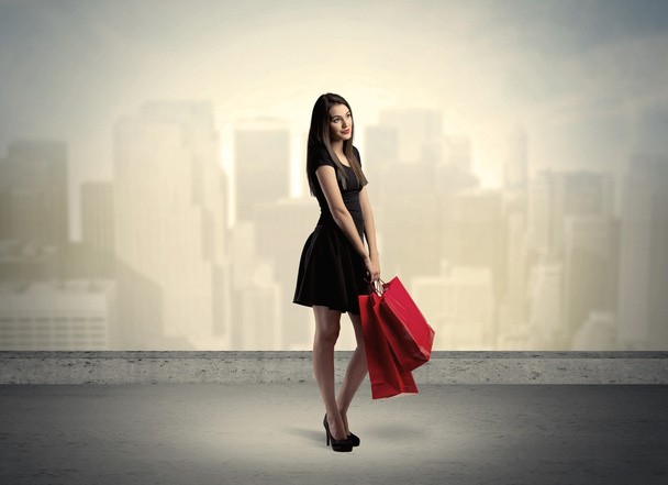 City woman standing with shopping bags - Photo, Image