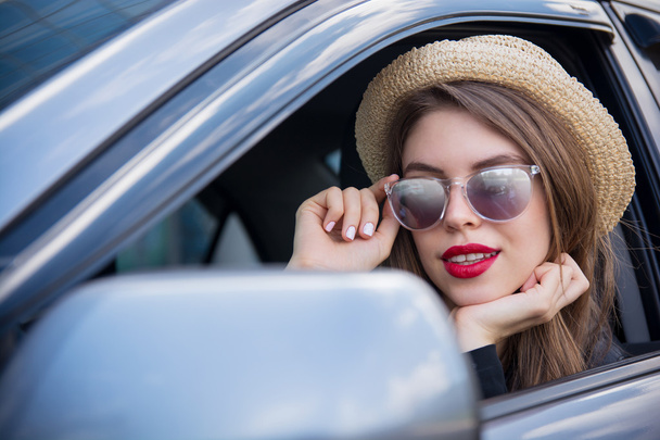 happy woman in summer hat and sunglasses looking through glasses - 写真・画像