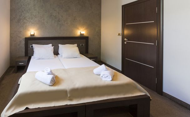 Interior of a luxury double bed hotel bedroom - 写真・画像