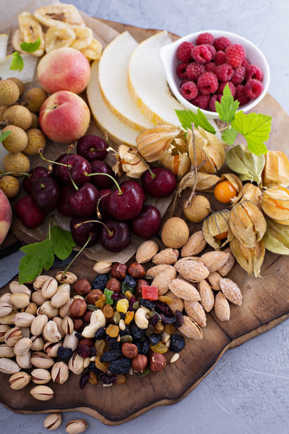 Fruit and nuts snack board - Fotoğraf, Görsel
