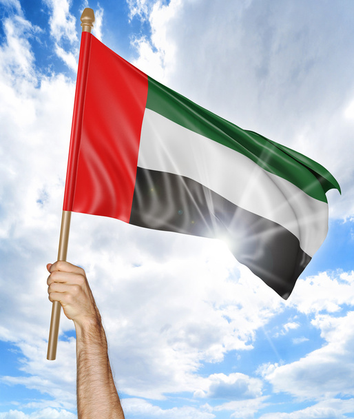Osoby za rękę trzyma flagę narodową Emiratów i macha to w niebo, renderowania 3d - Zdjęcie, obraz