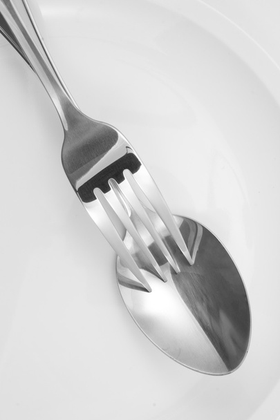 Fork and spoon on a plate with napkin - Φωτογραφία, εικόνα
