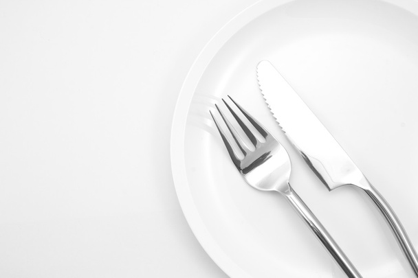 plate with fork and knife isolated - Foto, Bild
