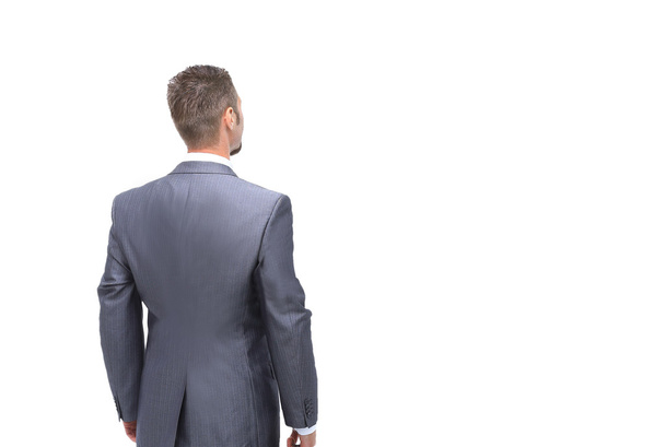 Businessman from the back - looking at something over a white ba - Foto, immagini
