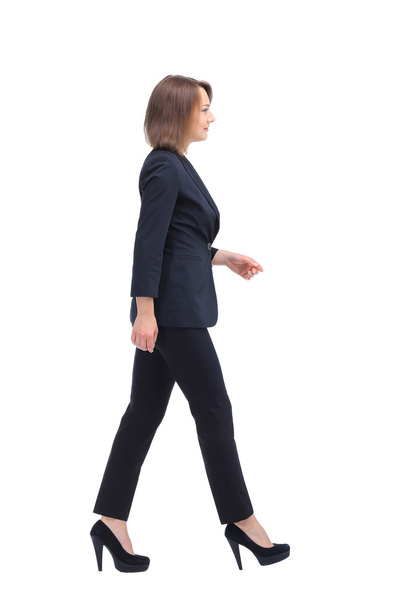 Full-length profile of walking businesswoman, isolated on white - Foto, imagen
