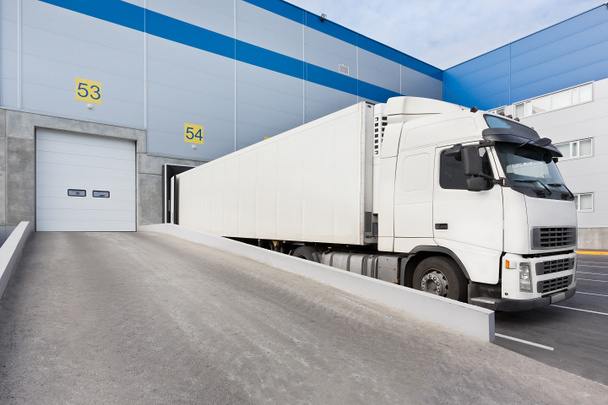 Truck while loading in a big distribution warehouse - Photo, Image