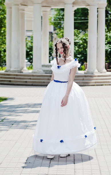 Girl in ancient dress with crinoline on the background of the rotunda - Photo, image