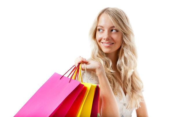 Blonde woman holding shopping bags - 写真・画像