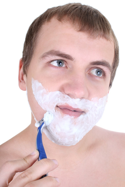 Joven afeitándose con afeitadora
 - Foto, imagen