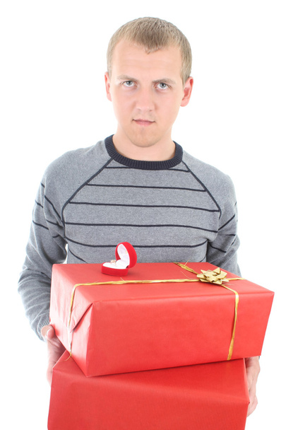 Young man holding gifts - Valokuva, kuva
