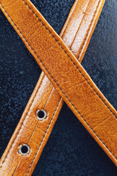 Male brown leather belt on a blue background - Foto, immagini