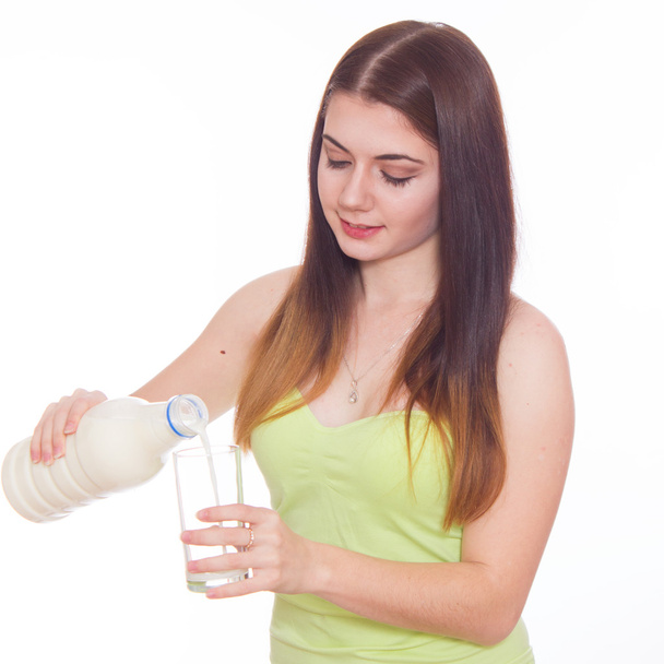 Young woman is drinking milk - Foto, Imagen