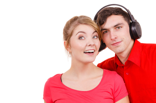 Couple two friends with headphones listening to music  - Фото, изображение