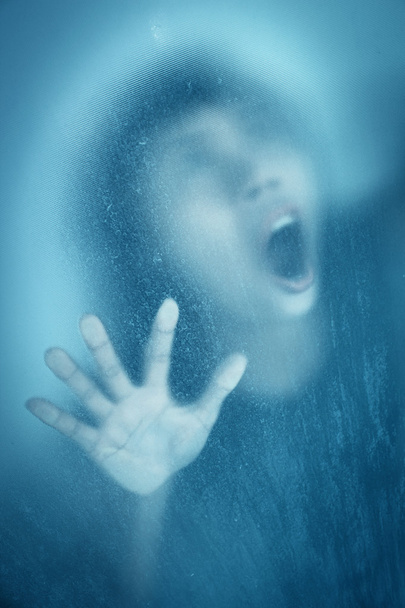 Woman screaming behind stained or dirty window glass - Foto, Bild