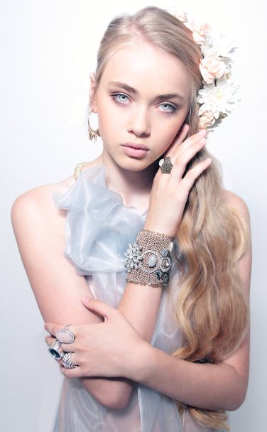Portrait of beautiful young teenager girl in jewelery weared blu - Foto, imagen