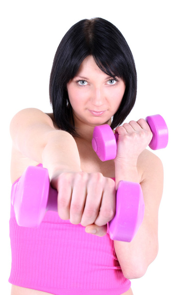 Young healthy girl with pink dumbbell - Foto, imagen