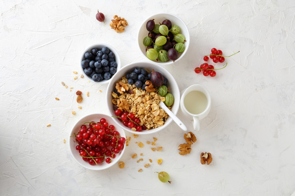 breakfast granola in bowl with berries - Фото, изображение